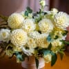 Experience the elegance of our exquisite ivory dahlia and white rose arrangement
