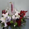 Centerpiece with spray roses, lilies, stocks, button daisies, and ornaments. 