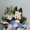 Box arrangement with mums, roses, lilies, and orchids 