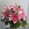 Vase arrangement with pink lilies.