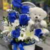 This beautiful arrangement in a round box features serene blue roses and