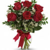 This charming bouquet includes six red roses accented with white waxflower and