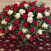 This beautiful spray with red and white roses deliver strength and wisdom