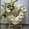 A heartfelt expression of love and remembrance, this heart-shaped easel arrangement honors