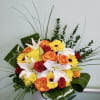 Box arrangement with gerbera daisies, roses, cushion daisies, and lilies. 