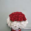 Box arrangement with hydrangeas and roses.