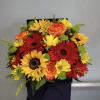 Box arrangement with sunflowers, daisies, gerbera daisies, roses, and buttons. 