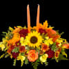 This traditional centerpiece includes a wonderful variety of Fall colors and blooms.