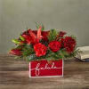 Deck their halls with this lively bouquet studded with surprising red lilies