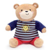 This plush beige bear is wearing a blue striped shirt with a