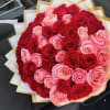 50 Red and Pink roses wrapped in a soft pink wrap with