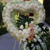 Open heart with white hydrangeas, white roses, peach roses, green roses, and