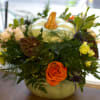 a beautiful blooming pumpkin, perfect for any occasion, especially a festive centerpiece.