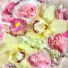 medium size floral in white glass vase fill with fabulist seasonal flowers