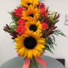 &quot;This proud and pretty arrangement holds nothing back. The colors, the flowers