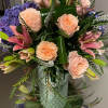 
Pretty pinks, luscious purple, peach petals gathered in a glamorous vase. Vases