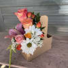 Flowers arranged in to-go cup holder,  drink on the other side