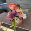 Flowers arranged in to-go cup holder,  drink on the other side