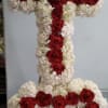 Cross and Heart with white hydrangeas and red roses.