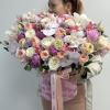Flower box with roses, peonies, orchids, lisianthus and other. 