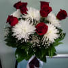 Vase arrangement with roses and mums.