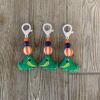 A super cute gator keychain with a light green gator focal point!