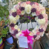 A beautiful white and green tribute wreath that calms, this easel arrangement
