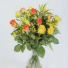 The product includes roses, delphiniums, dracaena relexa, and green leaves, in a