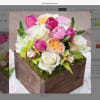 Wooden box fill with seasonal flowers combination .
Very popular floral arrangement with