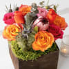 Wooden box fill with seasonal flowers combination .
Very popular floral arrangement with