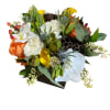Wooden box fill with seasonal flowers combination .
Very popular floral arrangement with