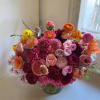 Vibrant and colorful arrangement with a mixed pallette of red, pink, orange