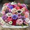 Beautiful and colorful stylish flower box full of fresh seasonal flowers in
