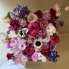 Beautiful and colorful stylish flower box full of fresh seasonal flowers in