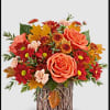 Capture their admiration with this enchanting fall rose arrangement, elegantly complemented by