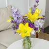 The products include lilies, daisies and gladioli, which are held in glass
