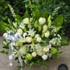 In all white, this arrangement is pure and tranquil. Featuring a variety