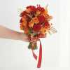 Product contains red rose, yellow rose and leaf stuffing, tied with ribbon