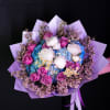 The Amethyst Dreams Bouquet is a mesmerizing floral arrangement that captures the