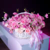 The Blush Harmony Basket is a stunning arrangement of soft pink blooms