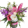 This arrangement contains spray roses, roses, whimsical snapdragons, stock some orchid&#039;s and