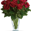 As classic as you can get! One dozen iconic red roses are