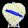 This 24" heart is covered with White Roses and a personalized ribbon