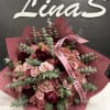 A graceful bouquet of peonies and spray roses, combining the lush, voluminous