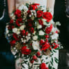 A Show stopper Wedding Bouquet! Cascading bouquet of red roses, red spray