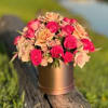 Bright red roses symbolize passion and deep feelings, and delicate coral shades