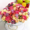 A bright mix of multicolored roses in a stylish box embodies&nbsp;joy and