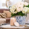 With a clear, glass hobnail textured jar and a silver lid, our