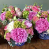 This arrangement contains peonies, hydrangeas, lisianthus, roses.
