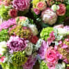 This arrangement contains peonies, hydrangeas, lisianthus, roses.